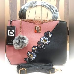 Brand New Leather Woman Shoulder bag with flower design.